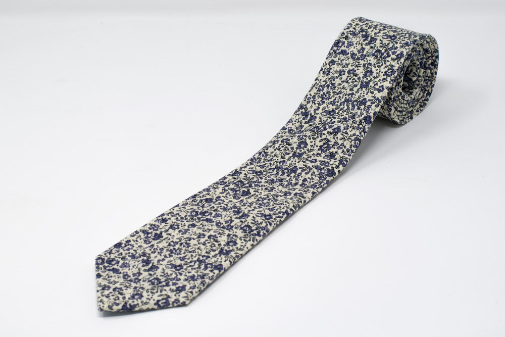 Purple floral necktie. Tie with various flowers on white background purple tie.
