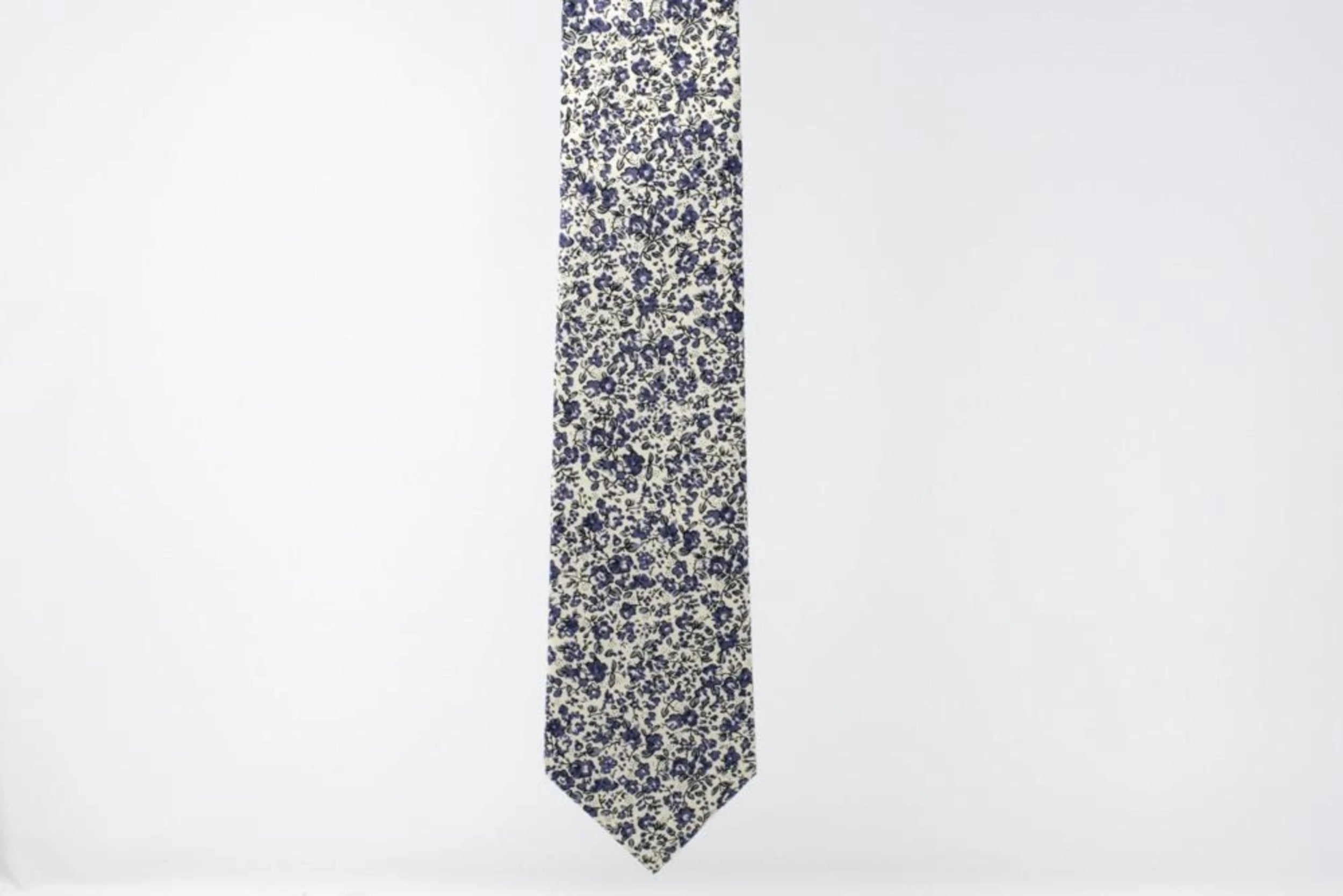 Full Length Purple floral necktie. Tie with various flowers on white background purple necktie.