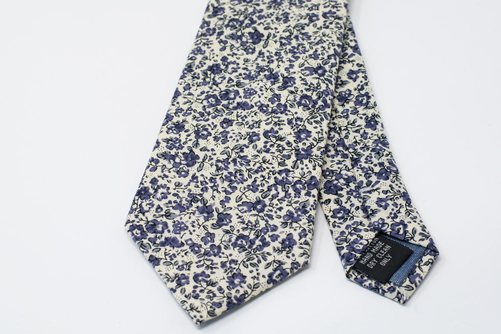 Purple floral tie. Tie with various flowers on white background of purple floral tie.